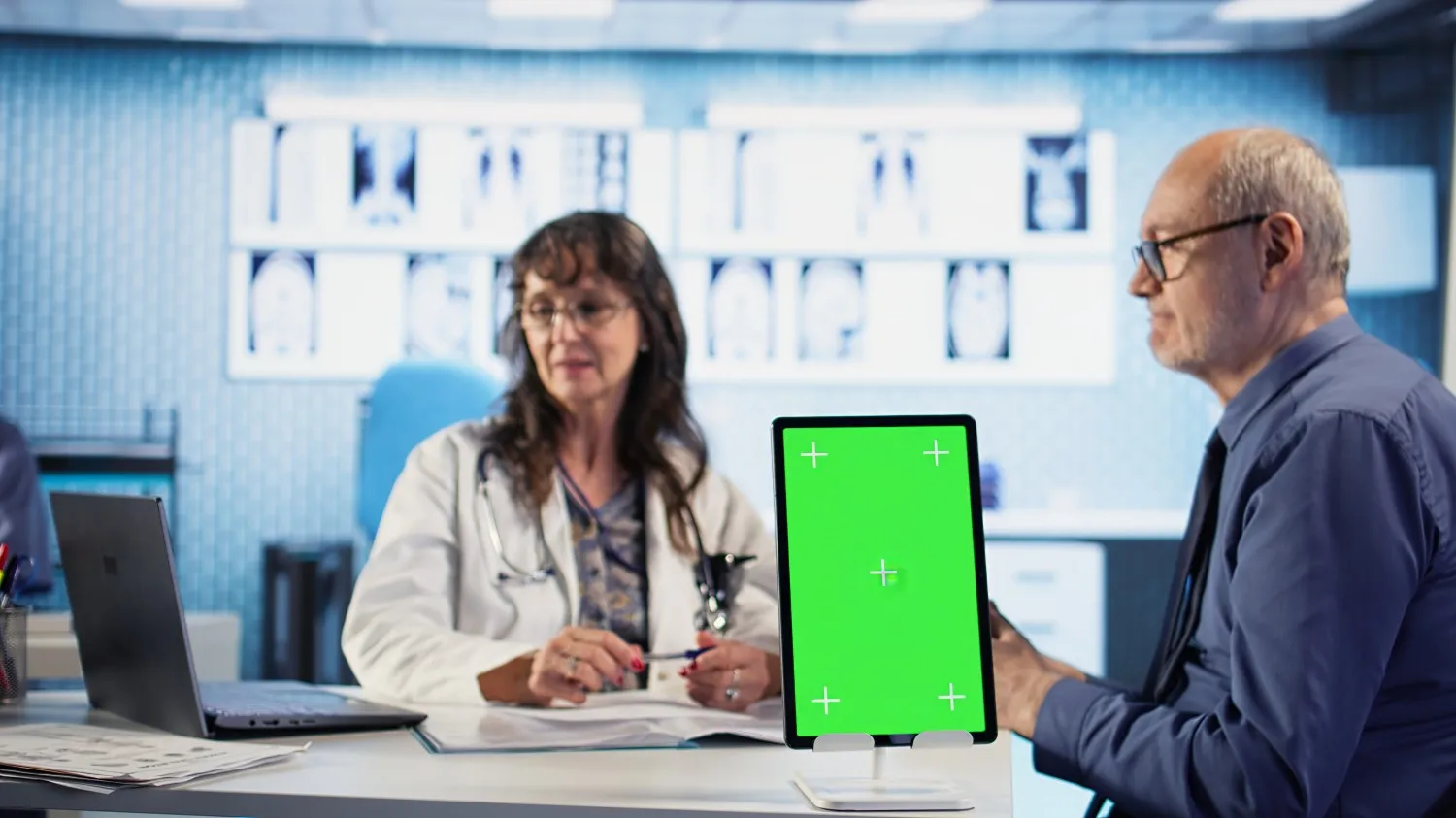 Healthcare professional using touchscreen tablet for EHR documentation
